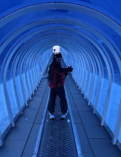 Carpet and covered conveyor or magic carpet on bunny slope at ski resort.