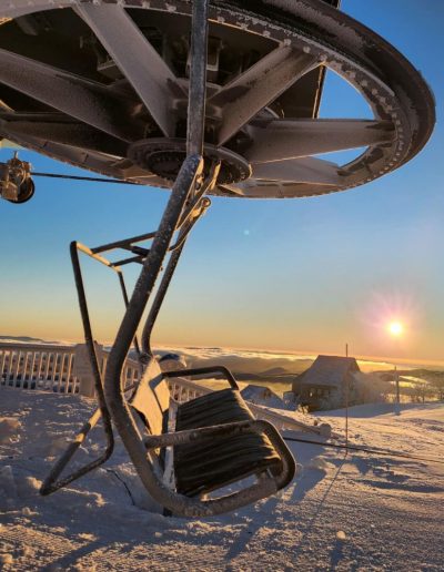 Chair lifts on top of snowy mountain at ski resort just outside of Boone, NC. ac