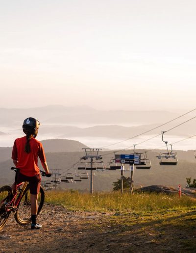 Person on mountain bike at mountain bike trails at Beech Mountain ski resort.