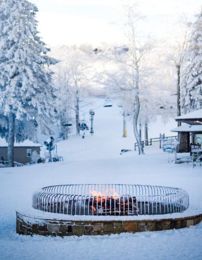 Fire pit at snow skiing and snowboarding lodge in North Carolina Mountains.