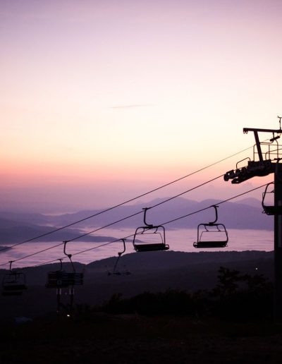 Chairlift rides in front of sunset near Boone, NC.