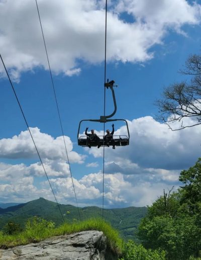 Men riding on scenic chairlift ride near Banner Elk, NC.