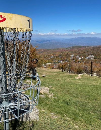 Disc golf target at frisbee golf course on mountain near Boone, NC.