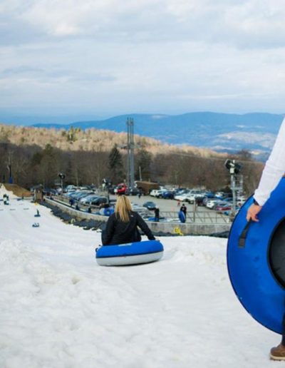 Man getting ready to snow tube near Boone, NC.