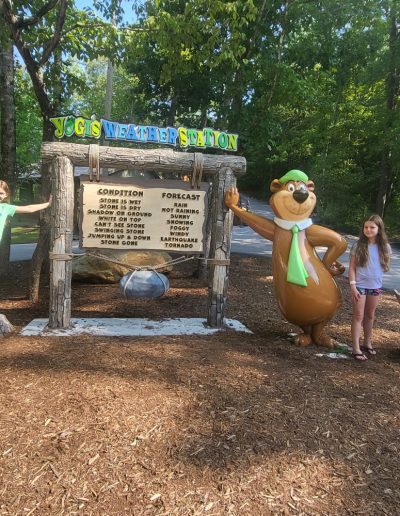 Kids next to campground sign in Western, NC.