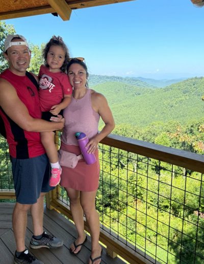 Family at observation tower hiking trail at Jellystone campground.