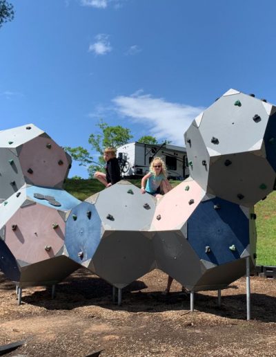 Kids climbing on climbing wall at campground near Charlotte, NC.