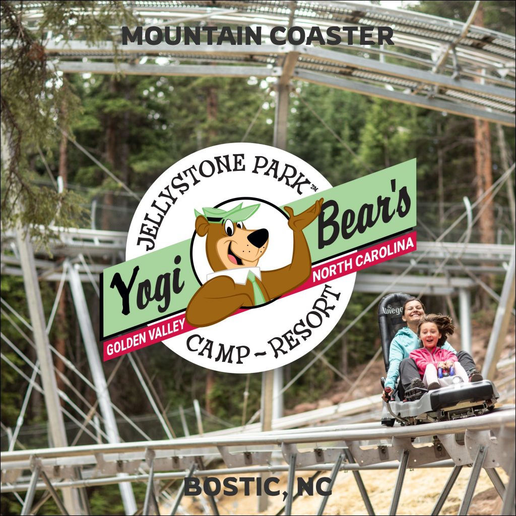 Mother and daughter riding down mountain coaster at Jellystone Park near Asheville, NC.