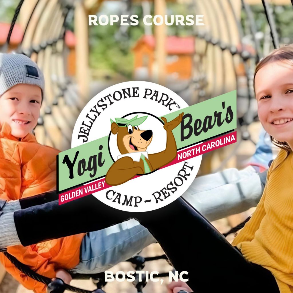 Children playing in ropes course tunnel at Jellystone Park near Boone, NC.