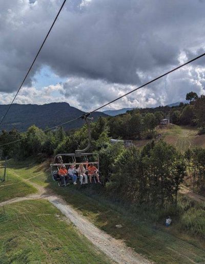 People on scenic chairlift ride at Sugar Mountain resort near Mountain City, TN.