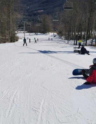 People snowboarding at Sugar Mountain resort near Banner Elk, NC.
