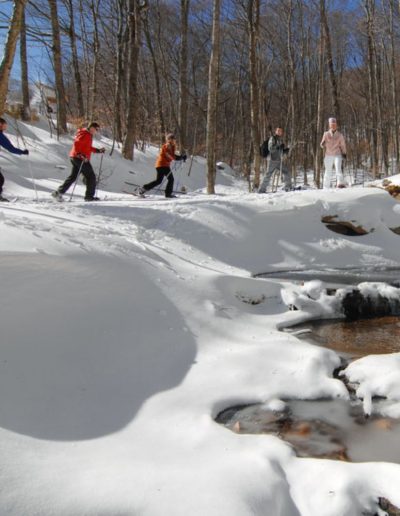 People snowshoeing at Sugar Mountain resort near Spruce Pine, NC.