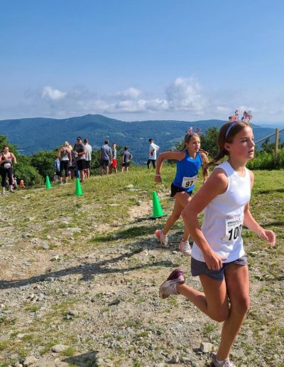 Kids running marathon on mountain trail at Sugar Mountain resort near Boone, NC.