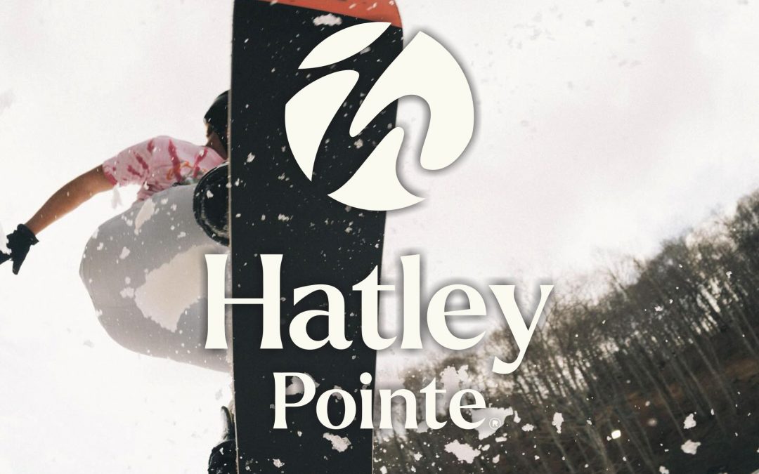 Family snowboarding at Hatley Pointe resort