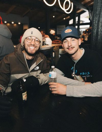 Couple snowboarding at Hatley Pointe resort