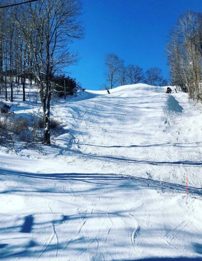 Snowboarder riding at Hatley Pointe North Carolina resort