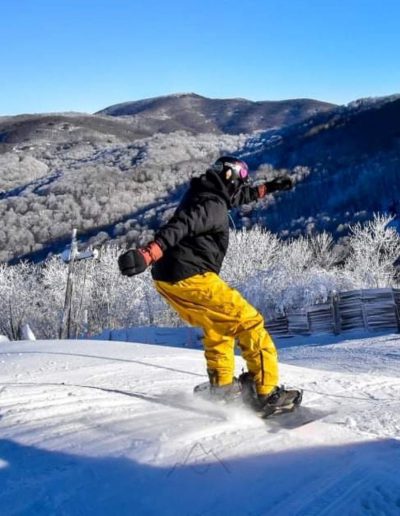 Advanced skier carving down Hatley Pointe mountain