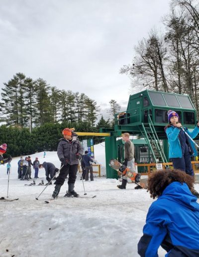 Skiers waiting to go up on lift at ski and snowboard resort near Greenville, SC.