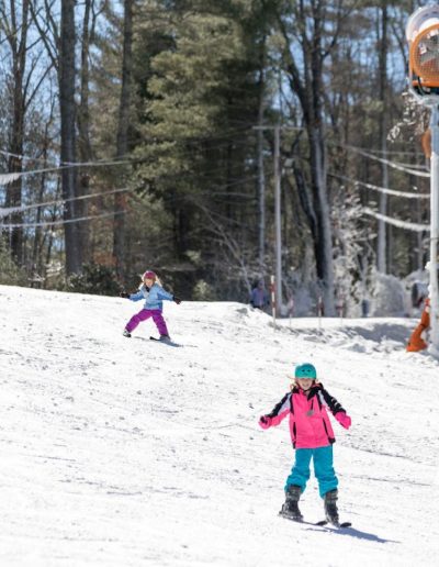 Kids snow skiing at ski and snowboard resort near Clemson, SC.