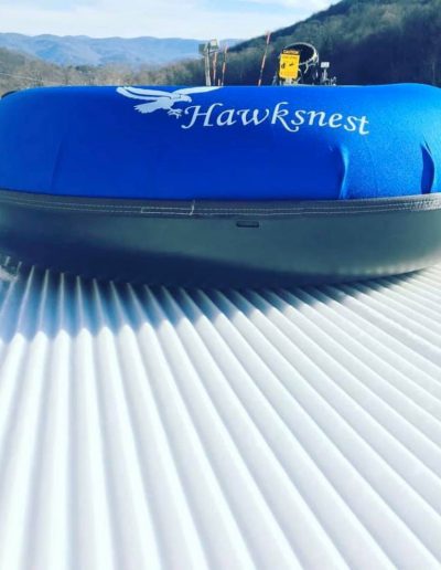 Snow tube on snow tubing lane at Hawksnest Adventures near Wilkesboro, NC.