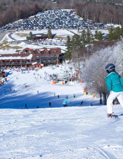 Person snowboarding down slope at Appalachian Ski Mtn in Blowing Rock, nc.
