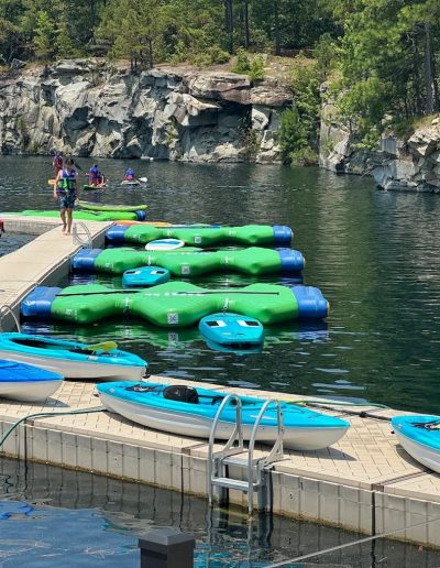 Family kayaking at Fantasy Lake Water Park in Wake Forest