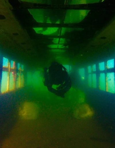 Certified divers exploring Fantasy Lake quarry dive site