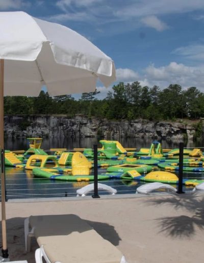 Families playing on lake inflatables at Fantasy Lake Adventure Park