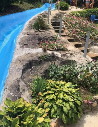 Visitors cooling off in the fresh natural-flow swimming pool at Sun Crest Water Park