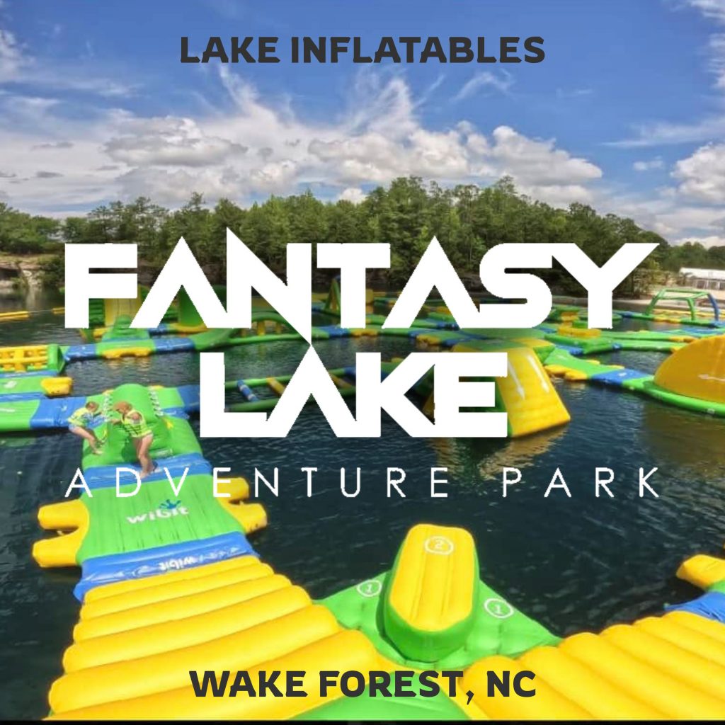 Kids climbing and sliding on lake inflatables at Fantasy Lake Water Park near Raleigh NC