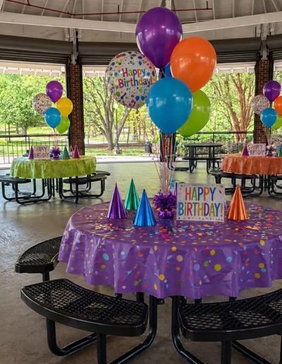 Park pavilion decorated for a colorful birthday party at Burlington City Park.