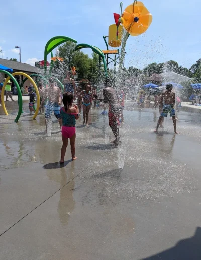 Children playing in the fountains at Burlington Splash Park.