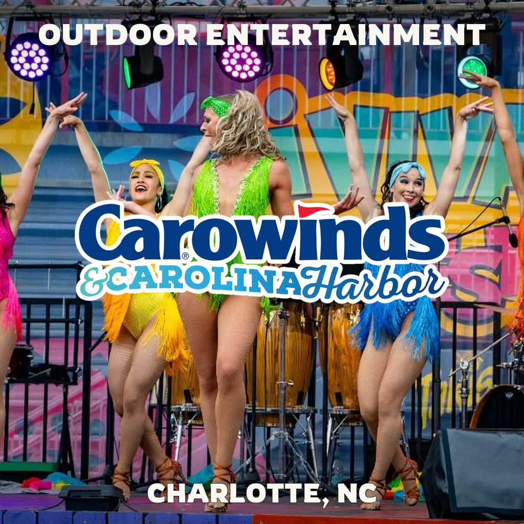 Outdoor entertainment at Carowinds in Charlotte, NC, with dancers and Carowinds logo