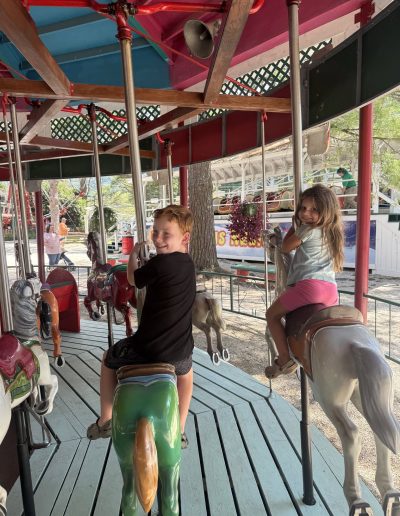 Children riding carousel horses at Santa’s Land in Cherokee, NC