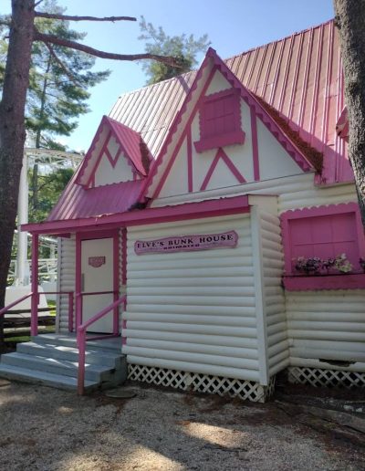 Pink-and-white Five-Bunk House building at Santa’s Land in Cherokee, North Carolina