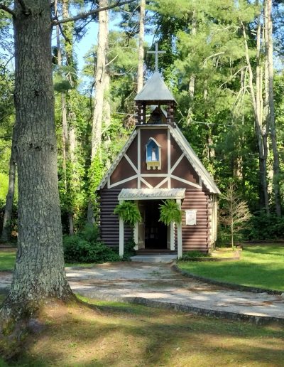 Small woodland chapel among trees at Santa’s Land in Cherokee, NC