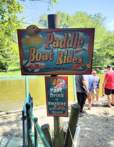 Paddle Boat Rides sign beside the lake at Santa’s Land in Cherokee, NC
