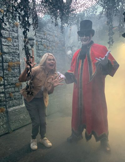 Guest posing with Ghost Train performer at Tweetsie Railroad