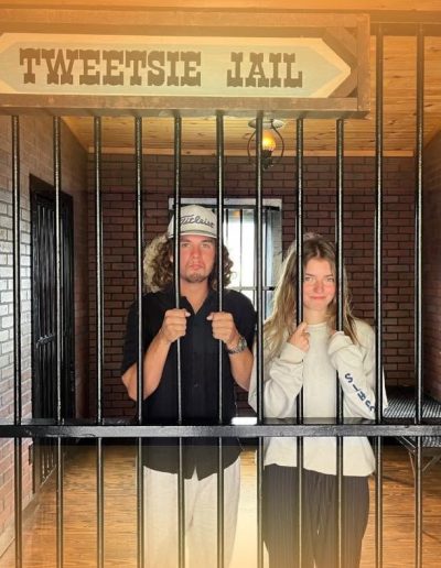 Visitors posing inside the Tweetsie Jail