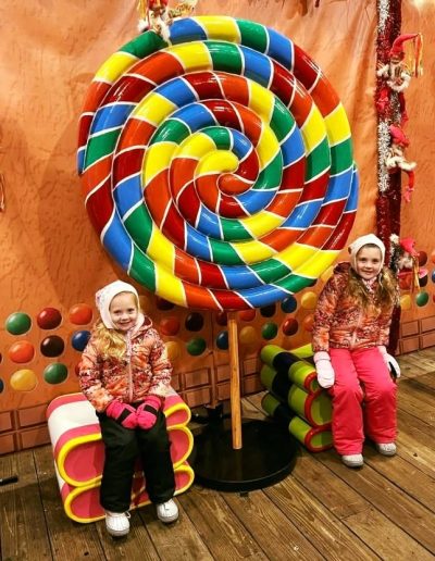 Children at a giant candy display during Tweetsie Christmas