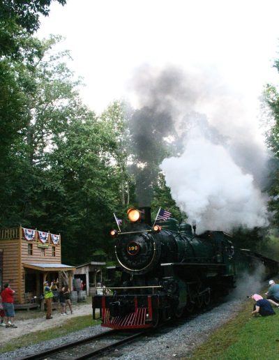 Tweetsie Railroad steam train traveling through the woods