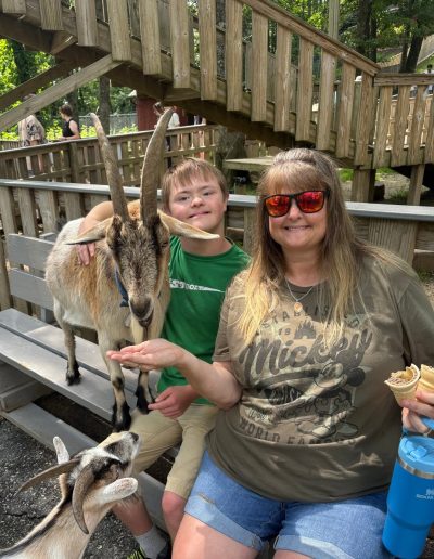 Family feeding goats at Tweetsie Railroad Deer Park