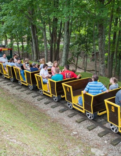 Passengers riding through the woods at Tweetsie Railroad
