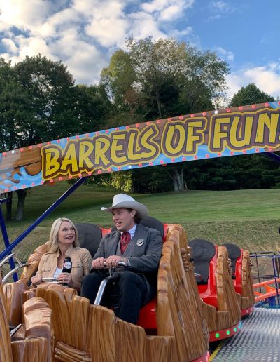 Parent and child on Barrels of Fun at Tweetsie Railroad