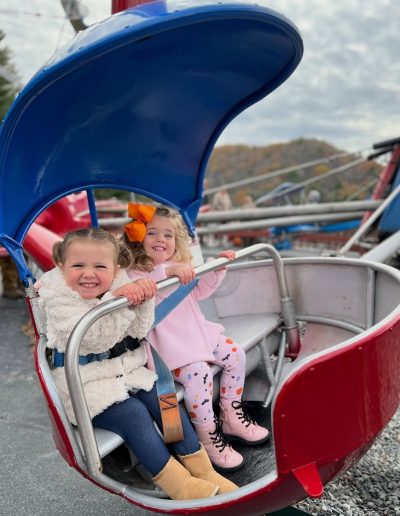 Children riding a spinning amusement ride at Tweetsie Railroad