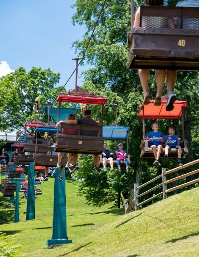 Guests riding the chairlift over Miners Mountain