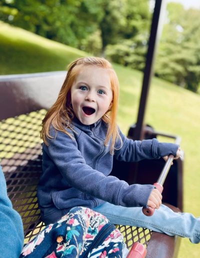 Young girl riding the chairlift at Tweetsie Railroad