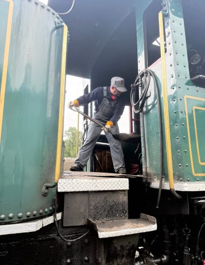 Engineer climbing aboard a Tweetsie Railroad locomotive