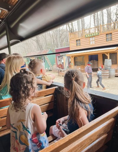 Children riding the Tweetsie Railroad Wild West train