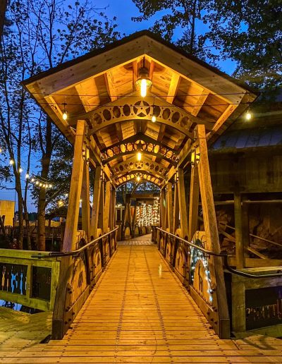 Covered wooden bridge lit at night at Deadwood near Williamston, NC